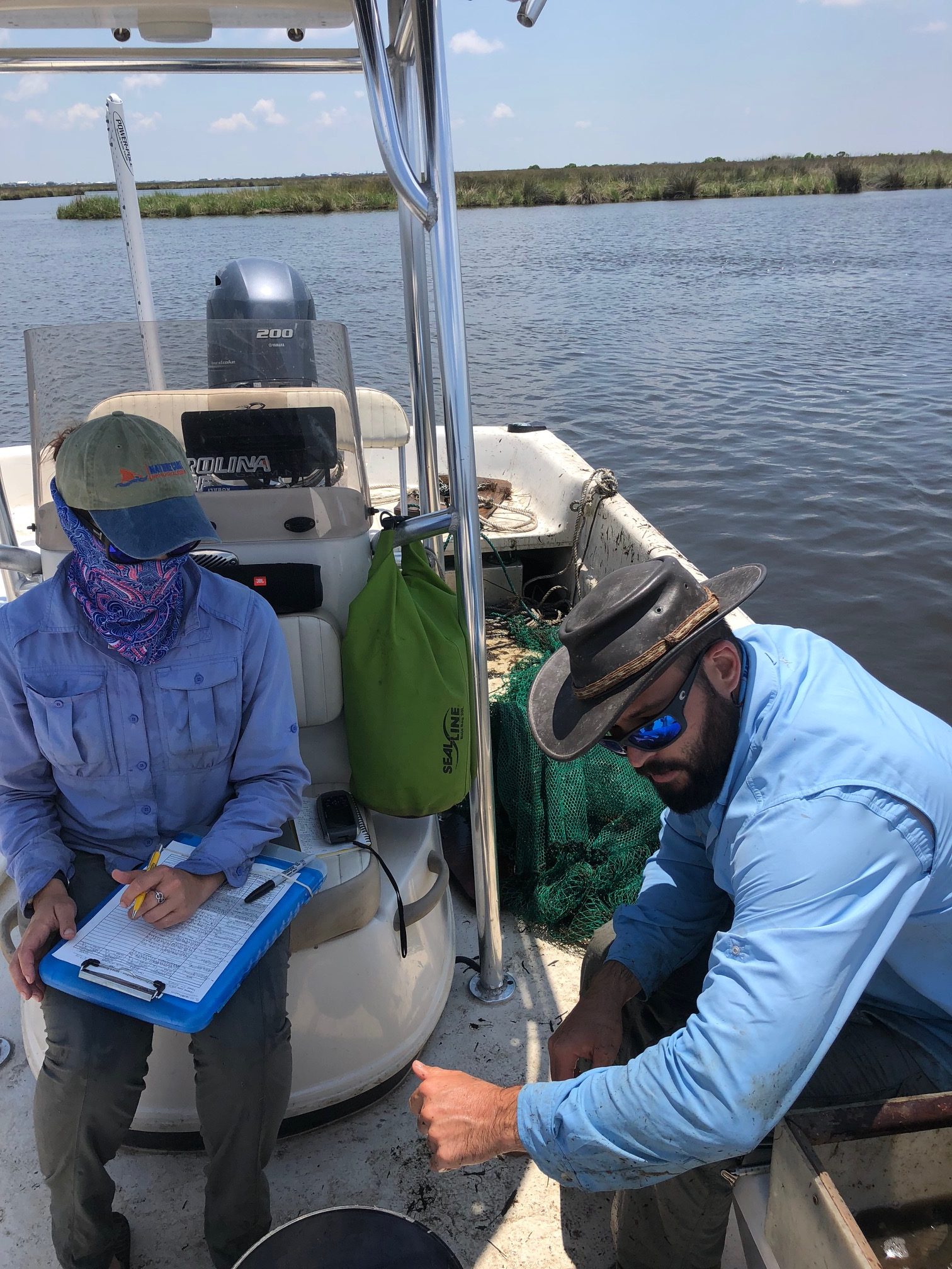 UF researchers take data of species abundance, length, and biomass on a recent sampling trip. Photo credit: C. Martin
